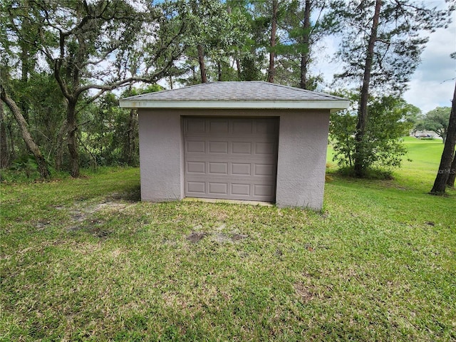 garage with a lawn