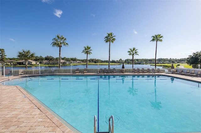 view of swimming pool with a water view