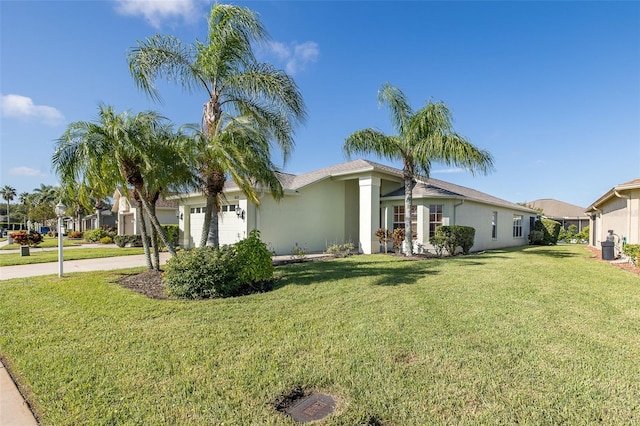 view of front of house with a front lawn and a garage