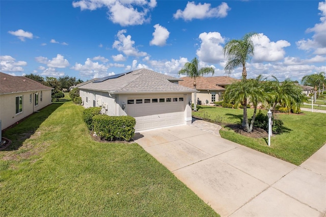 ranch-style home with a garage and a front yard