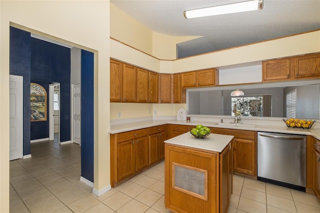 kitchen with kitchen peninsula, a kitchen island, dishwasher, and light tile patterned floors