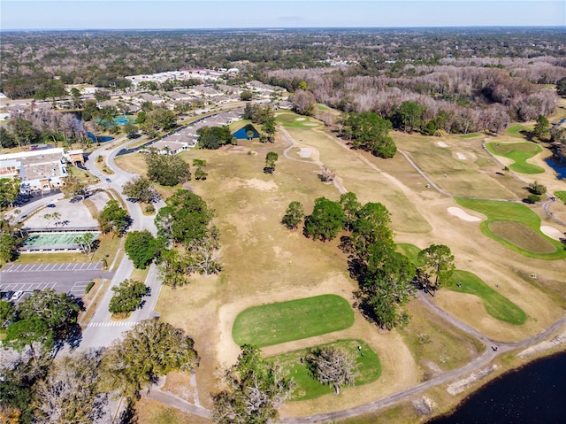 birds eye view of property featuring golf course view and a water view