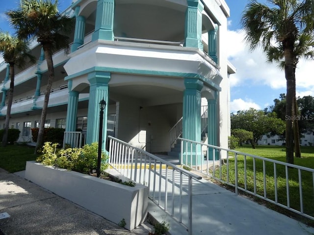 view of side of home with covered porch