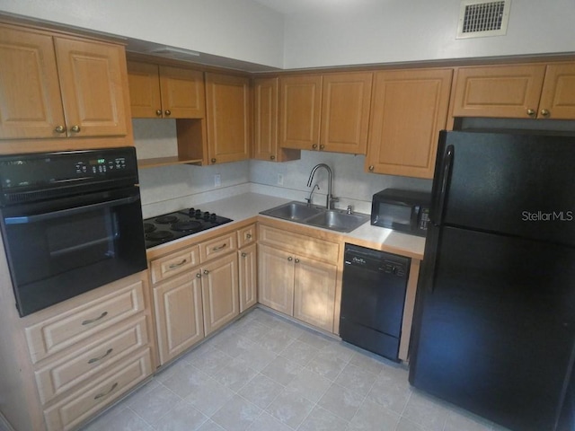 kitchen with black appliances and sink