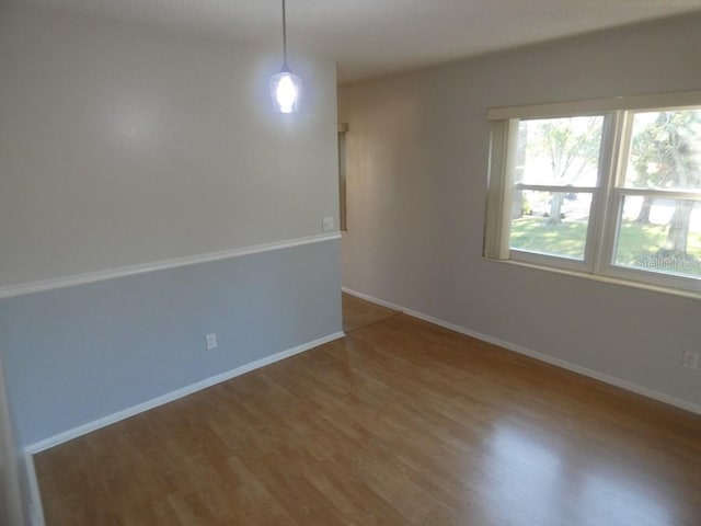 spare room featuring hardwood / wood-style floors