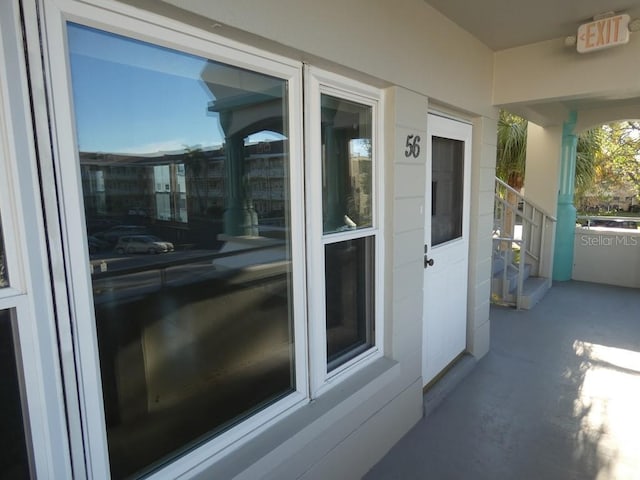 view of exterior entry featuring a porch