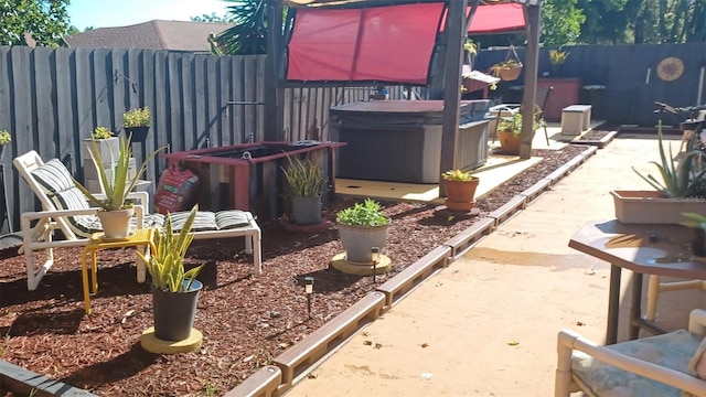 view of patio with a hot tub