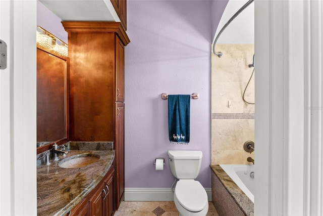 full bath with baseboards, vanity, toilet, and tub / shower combination