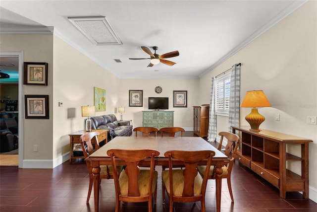 dining space featuring ornamental molding, dark wood-style flooring, and ceiling fan