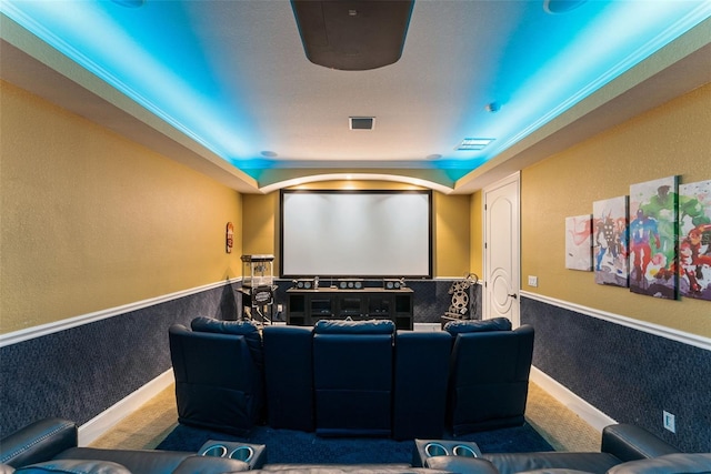 carpeted cinema with a wainscoted wall and visible vents