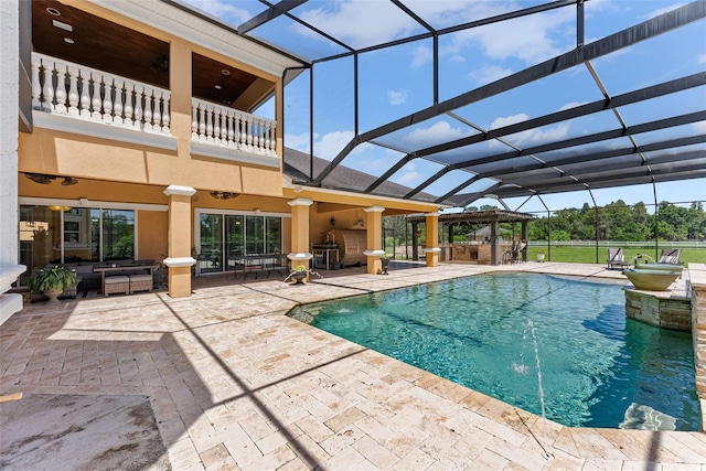 pool featuring a lanai and a patio area