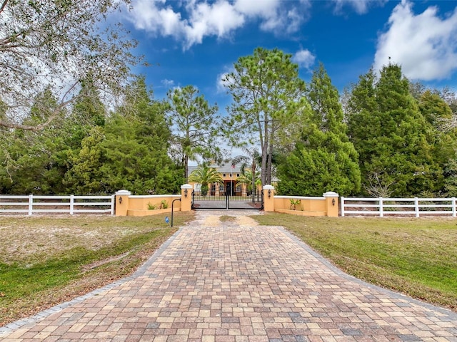 view of gate featuring a fenced front yard