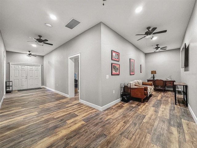 living room with baseboards and wood finished floors