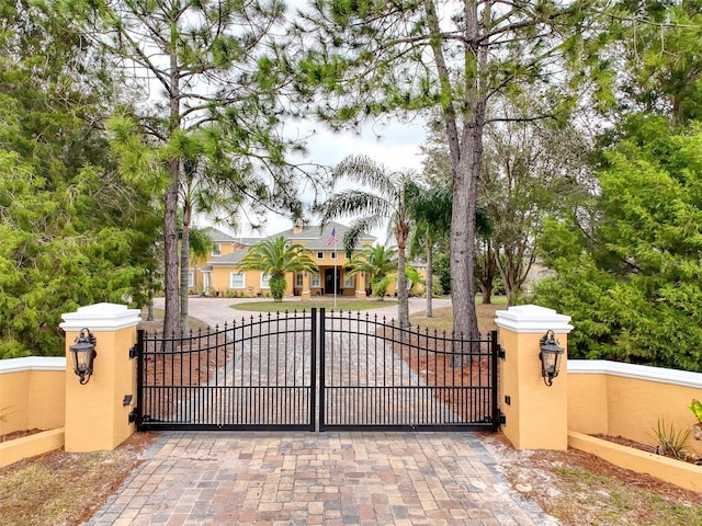 view of gate with fence