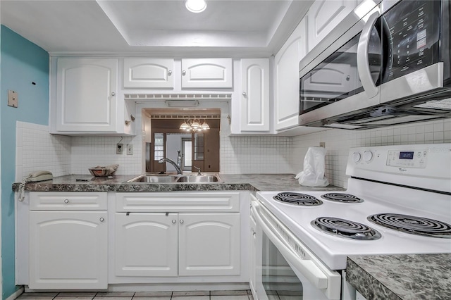 kitchen with white cabinetry, electric stove, tasteful backsplash, and sink