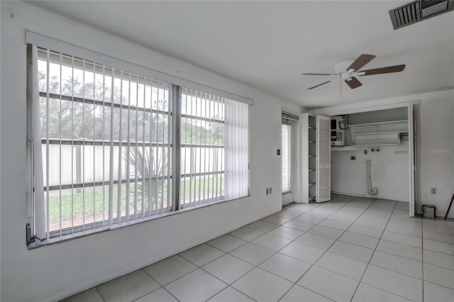 interior space featuring ceiling fan