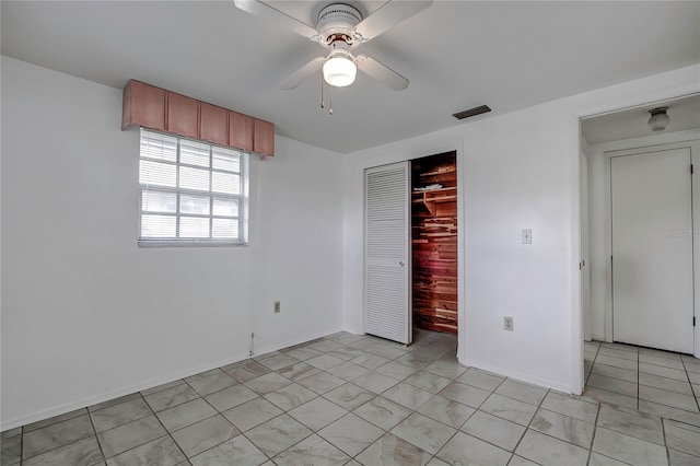 unfurnished bedroom featuring a closet and ceiling fan