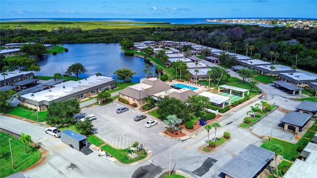 birds eye view of property featuring a water view