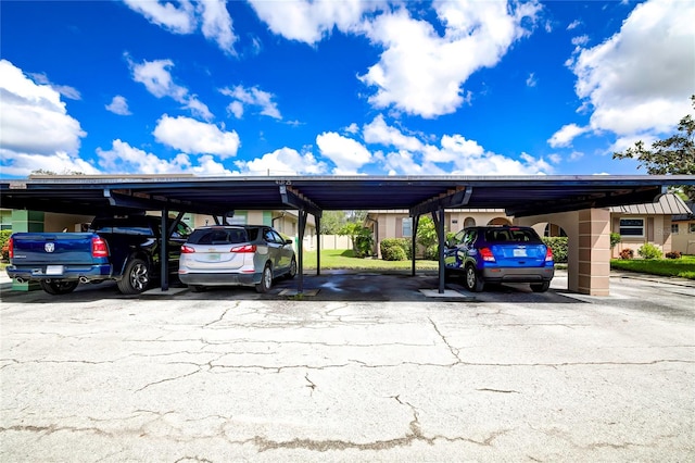 view of vehicle parking featuring a carport