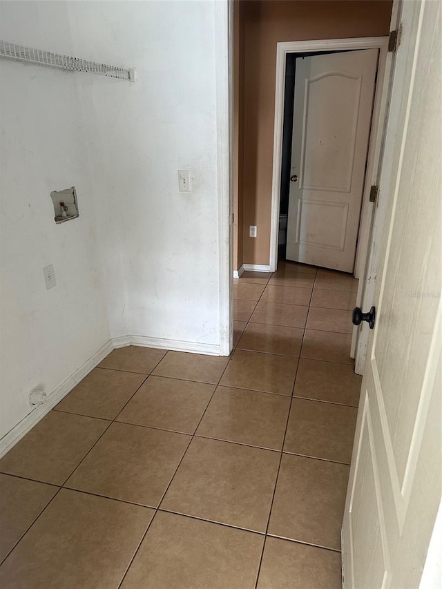 corridor with light tile patterned flooring