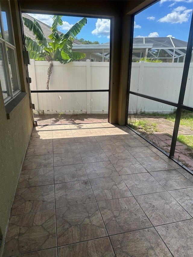 unfurnished sunroom featuring a wealth of natural light