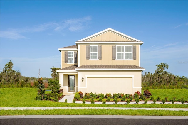 front of property featuring a garage and a front lawn