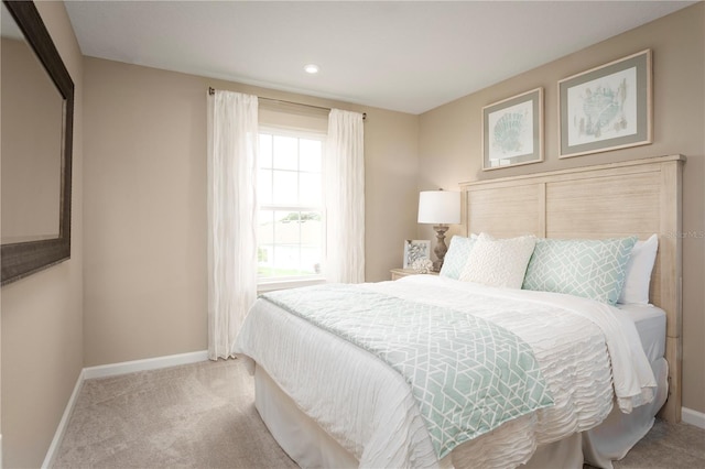 bedroom with light colored carpet