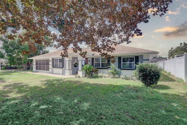 rear view of property featuring a yard