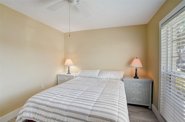 bedroom featuring ceiling fan and light hardwood / wood-style floors