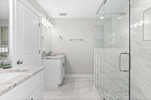 bathroom with vanity and an enclosed shower