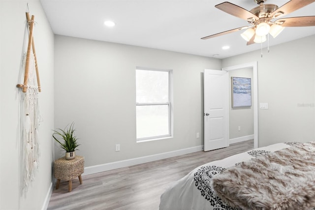 bedroom featuring light hardwood / wood-style flooring and ceiling fan