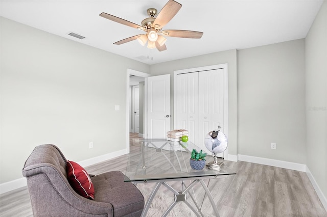 interior space with ceiling fan and light hardwood / wood-style flooring