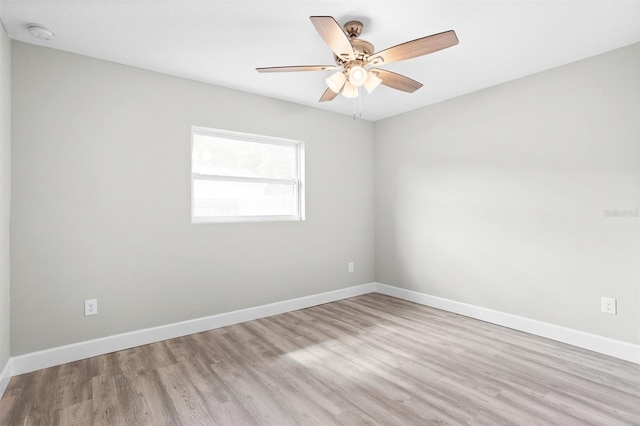 spare room with ceiling fan and light hardwood / wood-style floors