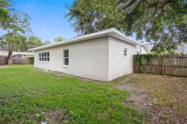 view of home's exterior featuring a yard