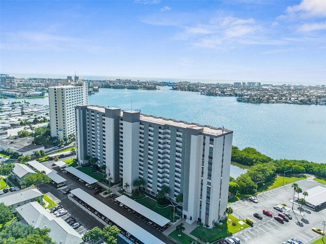 birds eye view of property with a water view