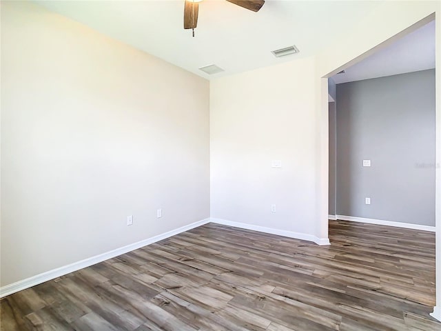 empty room with ceiling fan and wood-type flooring