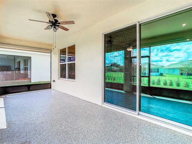 exterior space with ceiling fan