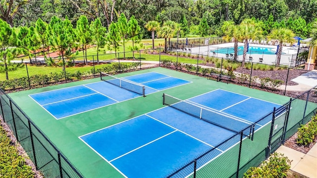 view of sport court with fence