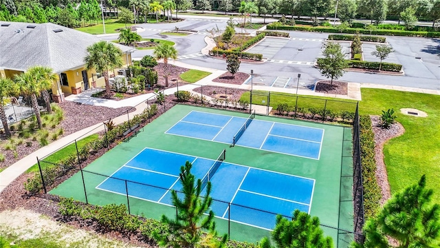 view of sport court featuring fence