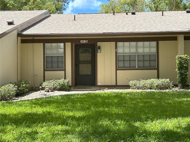 entrance to property with a yard