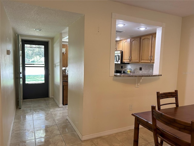 interior space with a textured ceiling