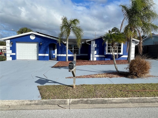 single story home featuring a garage