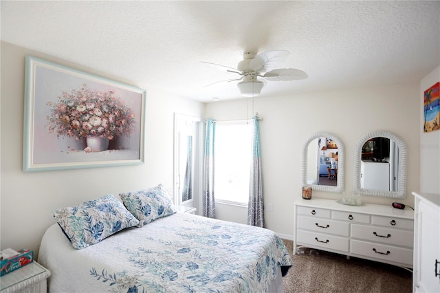 carpeted bedroom featuring ceiling fan and a textured ceiling