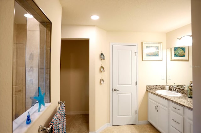 bathroom featuring vanity, a textured ceiling, and tile patterned flooring