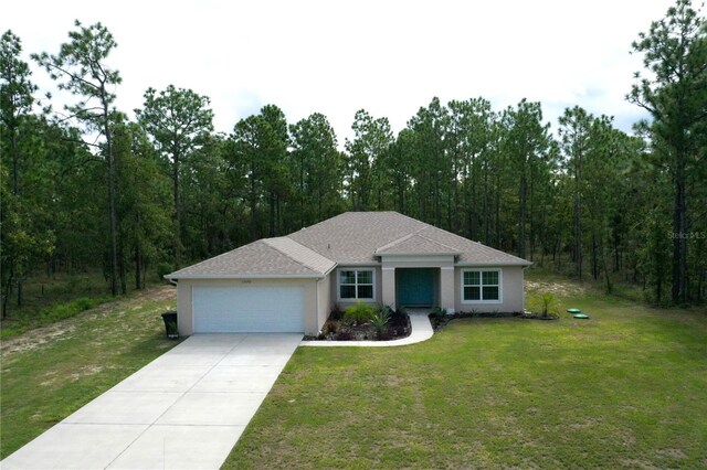 single story home with a front yard and a garage