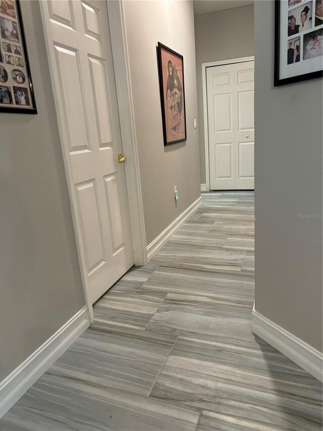 corridor featuring light hardwood / wood-style flooring