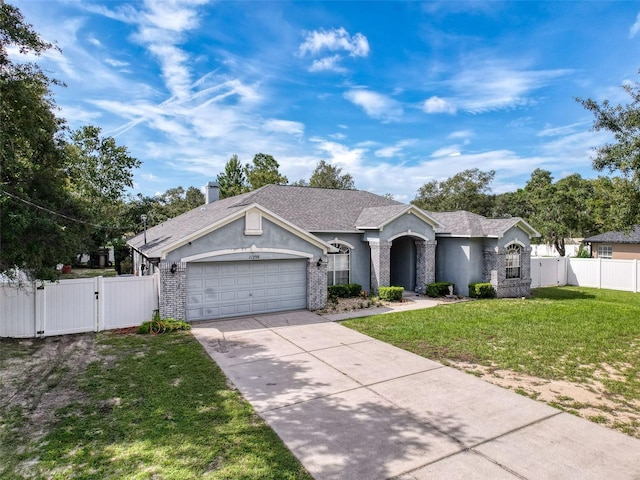 ranch-style house with a garage and a front yard