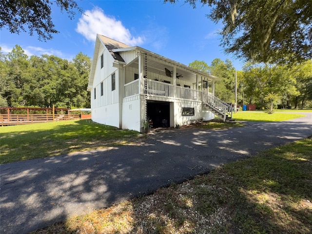 view of front of home with a porch and a front yard