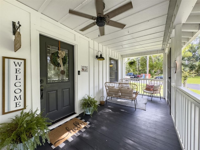 doorway to property with ceiling fan and covered porch