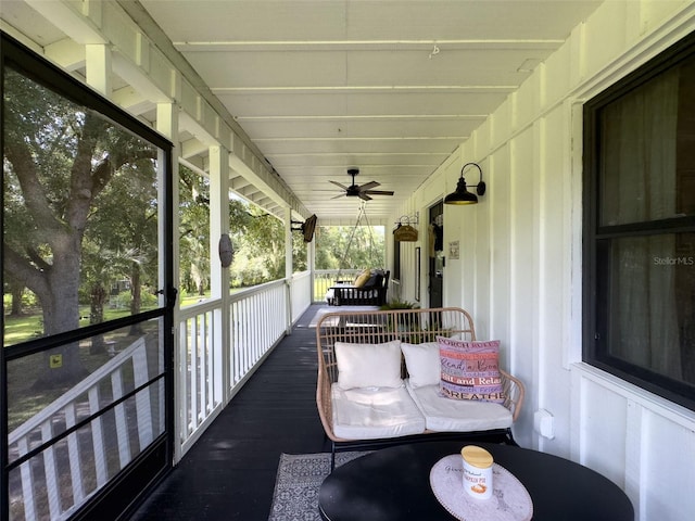 sunroom with ceiling fan